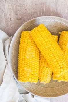 corn on the cob in a white bowl