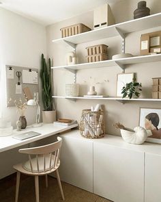 a white desk and shelves in a room