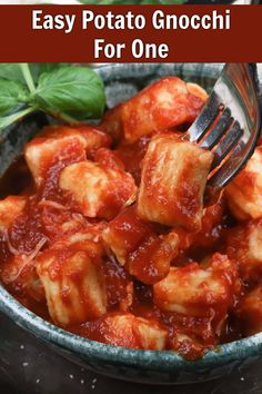 a close up of food in a bowl with text overlay that reads easy potato gnocchi for one