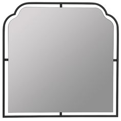 a mirror that is sitting on top of a table with a black frame and metal trim