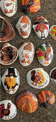 many different types of painted rocks with turkeys and roosters on them, all in different colors