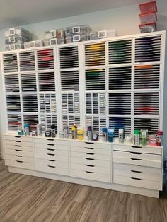 a large white cabinet filled with lots of drawers