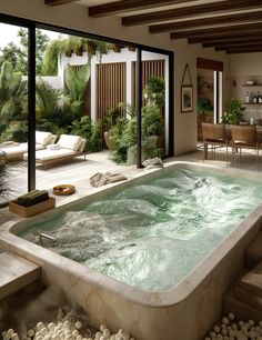 an indoor jacuzzi tub in the middle of a living room