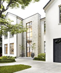 a white house with black doors and windows