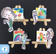 four children's artwork on clothes pegs