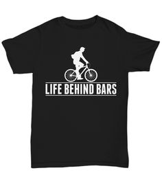 a black t - shirt with the words life behind bars printed in white on it