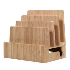 three wooden cutting boards stacked on top of each other