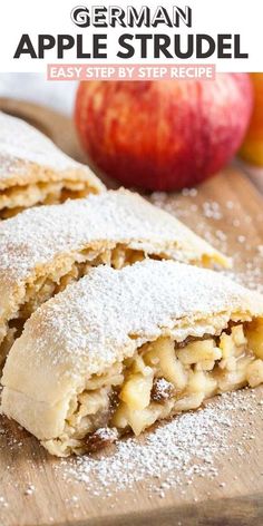 an apple strudel is cut in half on a cutting board