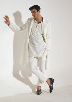 Editor's Note Featuring an ivory textured overcoat with cord embroidery detailing. Note: Inner kurta and pants worn by model is for styling purposes only Fabric: Crepe Color: Ivory Component: Overcoat Occasion: Formal Note: Product colour may slightly vary due to photographic lighting sources Care: Dry clean only About the Designer Jatin Malik Label is a renowned name in the world of menswear, known for its handmade, customized, and bespoke clothing. With a focus on individuality and attention t Jatin Malik, Cord Embroidery, Kurta And Pants, Blouse Yoke, Kurta Set For Men, Personal Shopping Service, Short Kurta, Bespoke Clothing, Indian Party