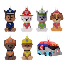 six different shaped ornament with dogs and firetrucks hanging from strings