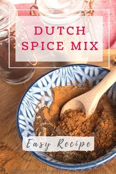 dutch spice mix in a blue bowl with a wooden spoon on the table next to it