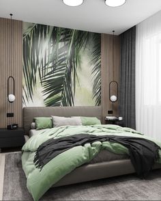 a large bed sitting in a bedroom next to a wall with palm leaves on it