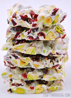 a stack of white chocolate barkies with cranberries and pistachio