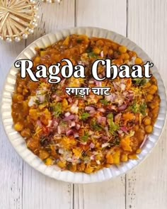 raga chaat in a white bowl on top of a wooden table