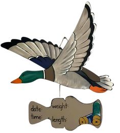 a wooden duck ornament hanging from a hook with the words date, time, length and weight on it