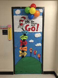 the cat in the hat door is decorated with balloons