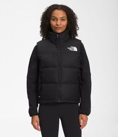 Built for mountain and city life, the Women’s 1996 Retro Nuptse Vest has an unmistakable silhouette. Featuring a water-repellent ripstop fabric and oversized baffles for warmth, this throwback design will help keep you dry and covered. 1996 Nuptse Jacket, Nuptse Vest, The North Face 1996 Retro Nuptse, 1996 Retro Nuptse Jacket, The North Face 1996, North Face 1996, Retro Nuptse Jacket, Nuptse Jacket, Ripstop Fabric