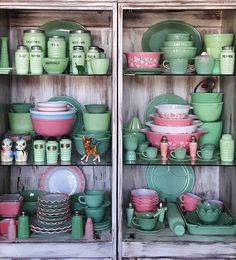 two shelves filled with green and pink dishes