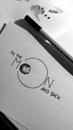 the logo for to the moon and back is shown on top of a piece of paper