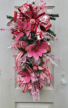 This XXL gorgeous poinsettia swag is just elegant!! They pink and red designer ribbons and poinsettias make this swag a step above all the rest. It is filled with beautiful designer florals to match the bright and beautiful ribbons.  It is 44 inch long and 20 inches wide. This stunning Christmas swag is ready for your front door today. Door Swag Diy How To Make, How To Make A Swag Wreath, Swag Wreaths For Front Door, Pointsetta Christmas, January Wreaths, January Wreath, Diy Swag, Poinsettia Decor, Home Decor Winter