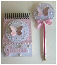 there are two pieces of paper with butterflies on them and a notepad that says glacia