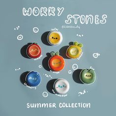 an assortment of different colored buttons on a blue background with the words worry stones written above them