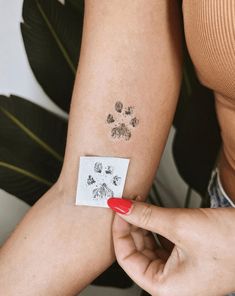 a woman with a small tattoo on her arm