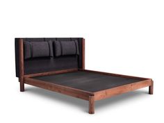 the bed frame is made from wood and black fabric