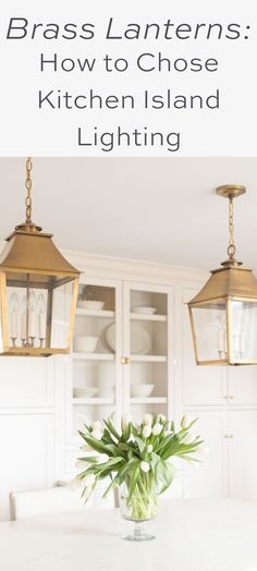 a white table with two hanging lights above it and the words brass lanterns how to choose kitchen island lighting