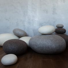 some white and brown rocks on a wooden floor