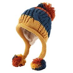 a knitted hat with two pom poms on the brim and bottom