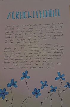 a piece of paper with blue flowers on it and the words acknowledmin written in cursive writing