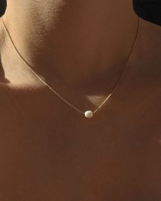 Classic to her core. Delicately strung on a delicate curb link chain, dainty freshwater pearl rests sweetly on the décolleté and is designed to wear with any and everything, all the time. How we style our necklaces: Created to layer with all our pieces, the style-outs are endless and effortless. We love to layer our pendants with our shorties and 20” necklaces. If layering isn’t your thing, no worries! Complete the solo look with a solid wrist stack and a midi ring. Best worn with a glowing smil Simple Pearl Necklace, Wrist Stack, Dainty Pearl Necklace, Classy Necklace, Wrist Stacks, Simple Pearl, Gold Vermeil Jewelry, Midi Ring, Jewelry Aesthetic