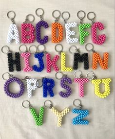 the letters and numbers are made out of plastic beads with key chains attached to them