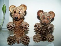 two small pine cones are made to look like mice