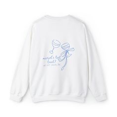 a white sweatshirt with blue writing on it