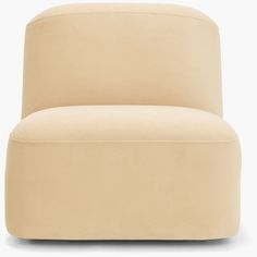 a beige chair sitting on top of a white floor