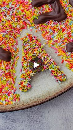 sprinkle covered pizza with chocolate toppings on it