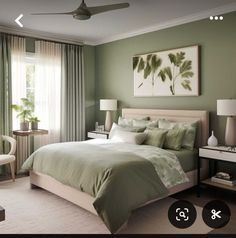 a bed room with a neatly made bed and green walls