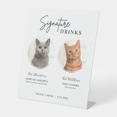 two cats are shown on the front of a card that says signature drinks, and one is