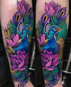 the legs are decorated with colorful flowers and peacocks on their legs, while one leg is