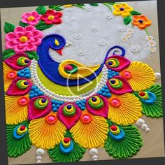 colorful peacock design on white cloth with flowers