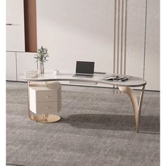 an office desk with a laptop on it in front of a white wall and carpeted floor