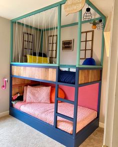 the bunk bed is made to look like it has swings and ladders on each side