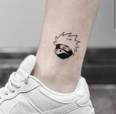 a small tattoo on the ankle of a woman's foot with an angry bird