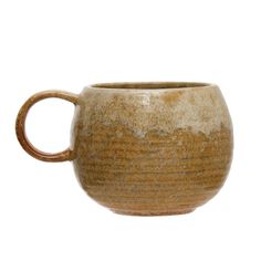 a brown and white ceramic mug on a white background