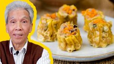 an old man with grey hair is looking at some food on a white platter