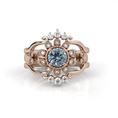 a ring with an aqua blue stone surrounded by white diamonds