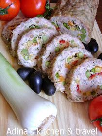 an assortment of food on a cutting board with tomatoes, celery and black olives