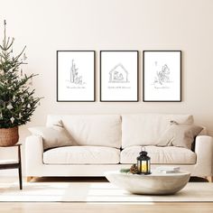 a living room with three framed pictures on the wall and a coffee table in front of it